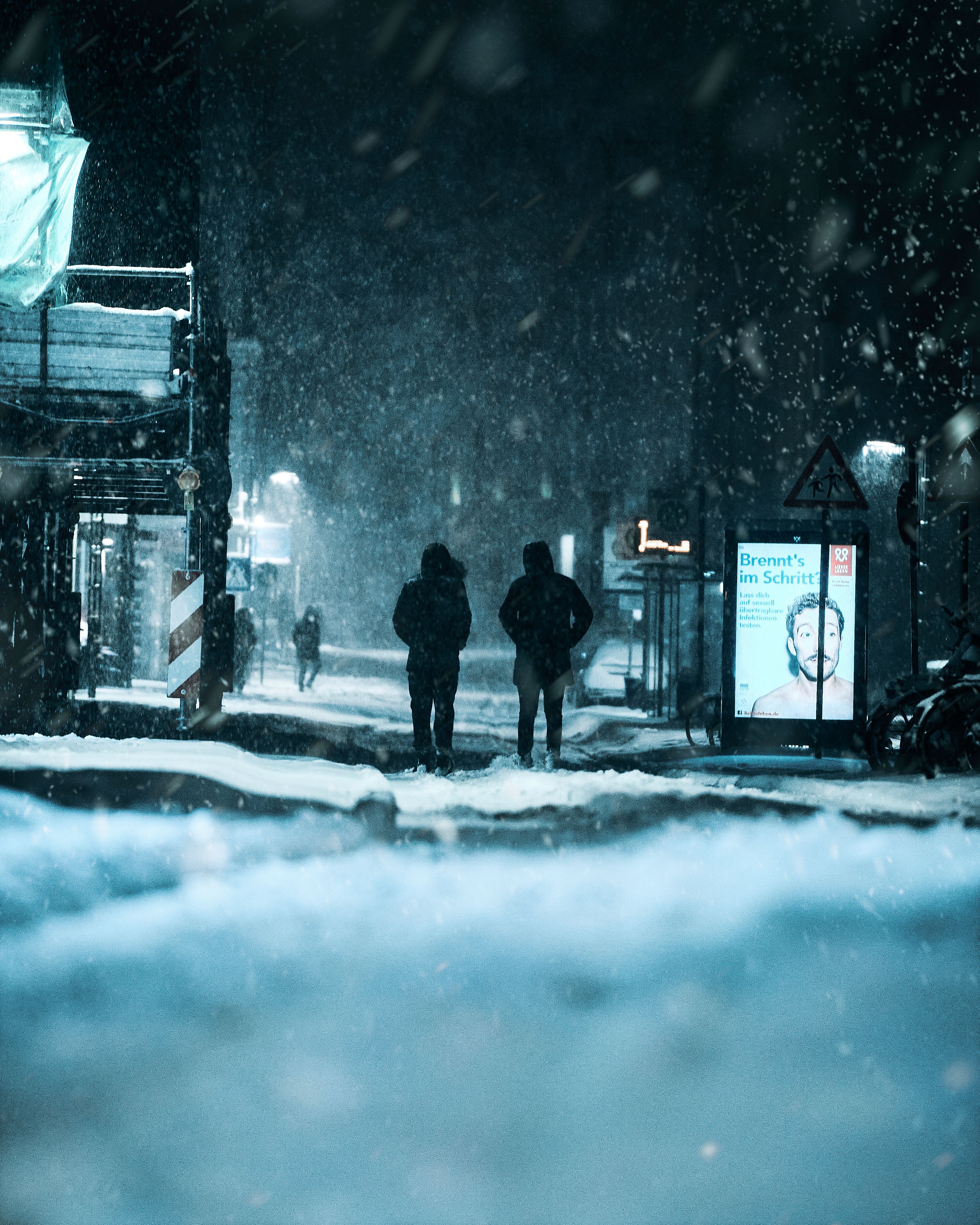 Two figures cross the snow in the dark — the Hollows don't feel the cold